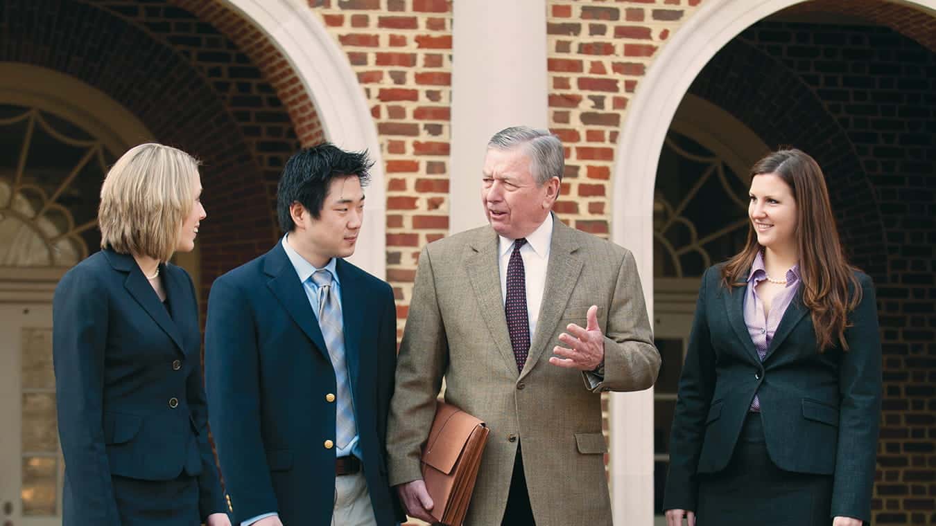 Distinguished Professor John Ashcroft with students: Explore the Certificate in the Law and Higher Education offered by Regent University.