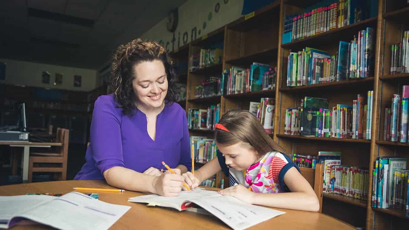 A teacher teaching a student: Explore the Certificate in Gifted and Talented Education for Teachers offered by Regent University.