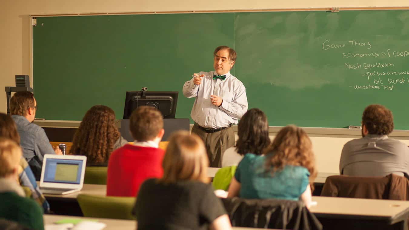 A professor teaching a class: Explore the Certificate in TESOL - Adult Education-Collegiate offered by Regent University.