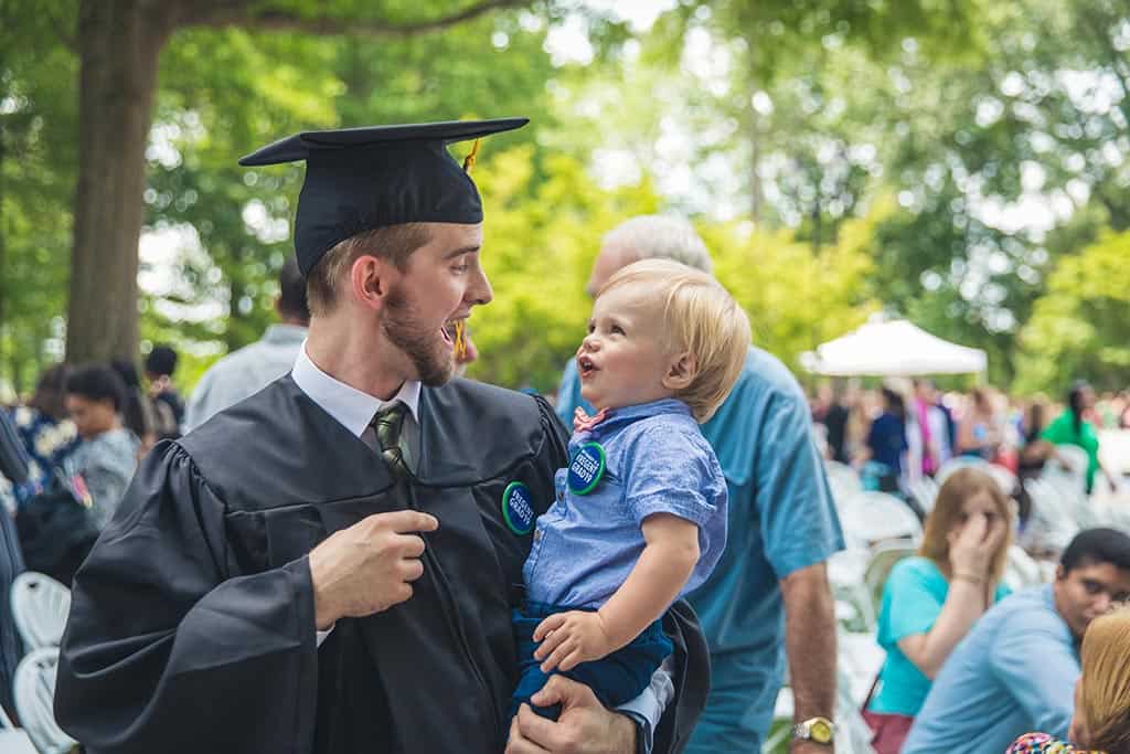 A Regent University graduate with his son.