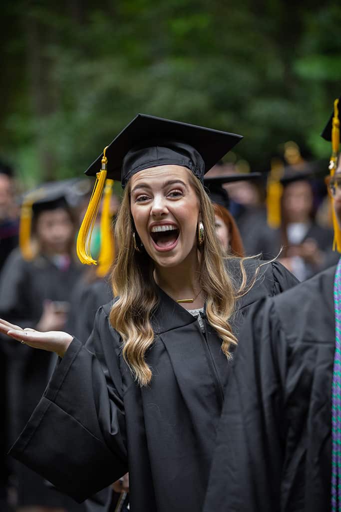 An excited graduate during Regent University's beautiful commencement ceremony in Virginia Beach.