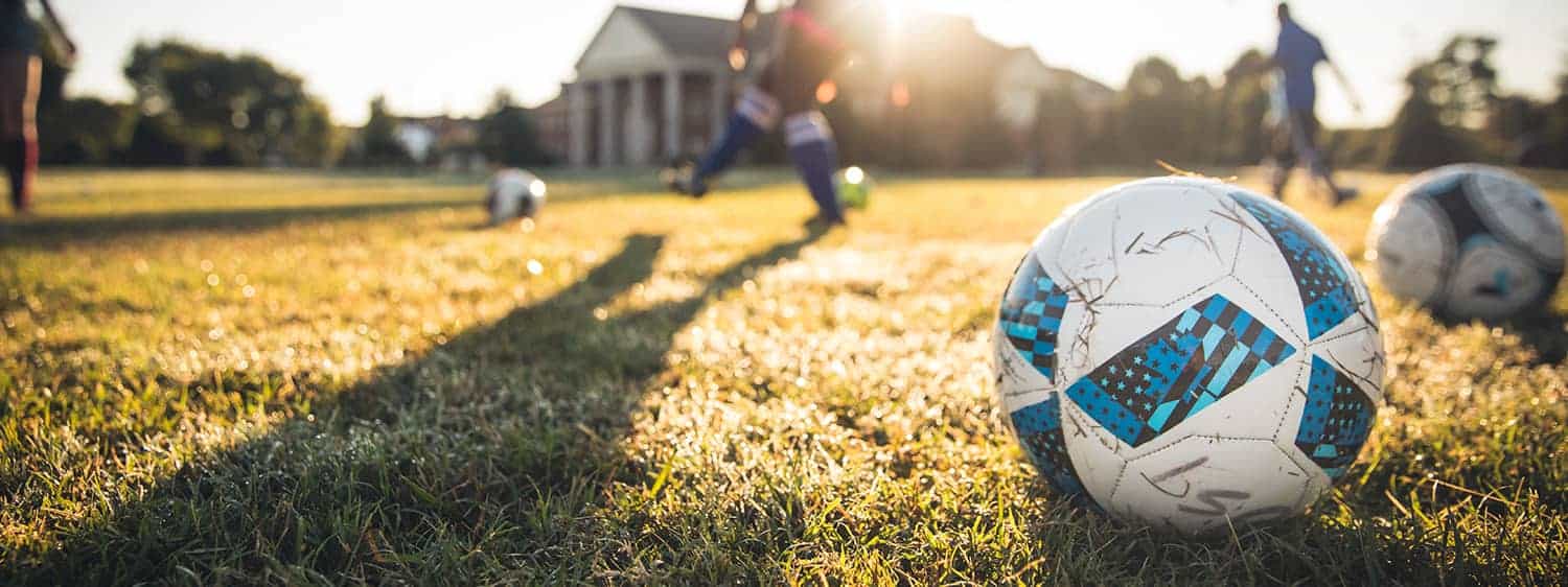 A soccer game on campus: Pursue a Sports Management program at Regent University.
