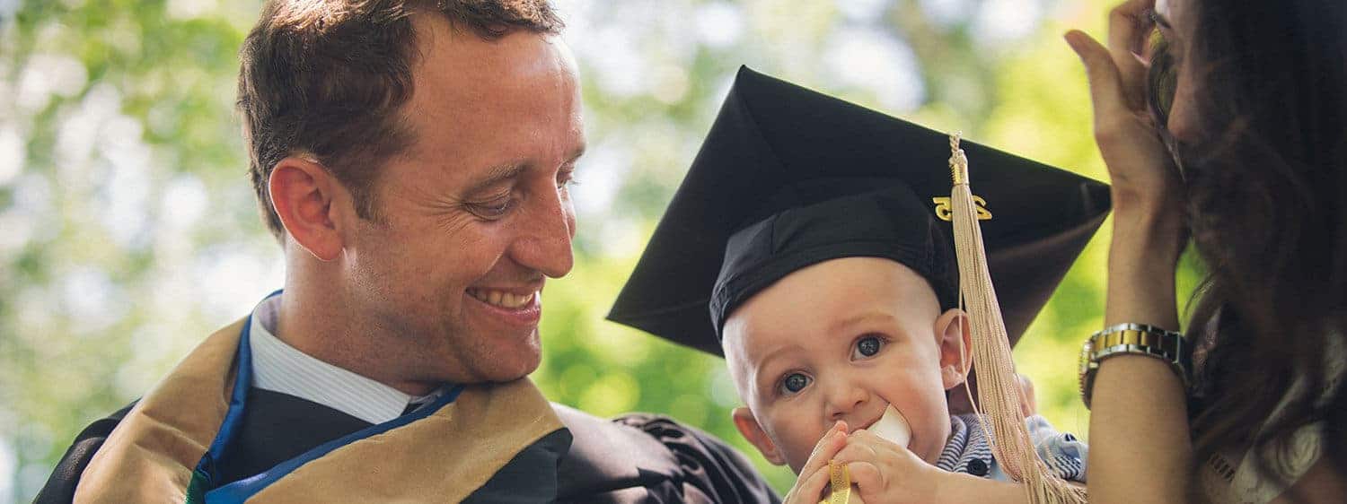 A Regent University graduate with his family on commencement day.