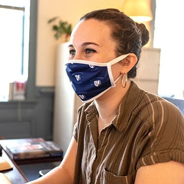 A Regent employee wearing a protective face mask.