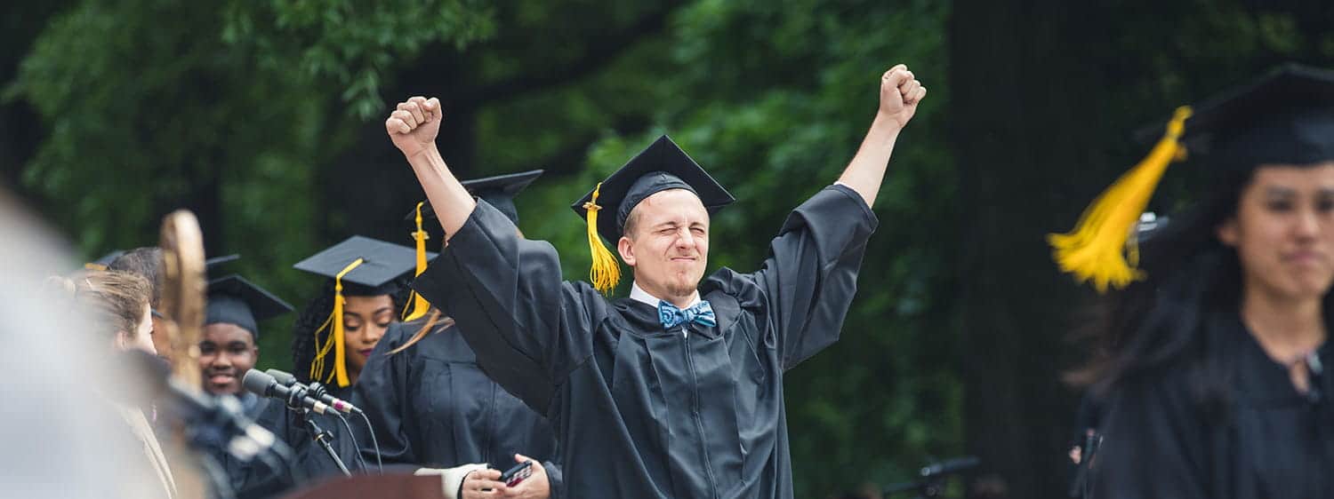 A graduate exults during Regent University's commencement ceremony in Virginia Beach, VA 23464.