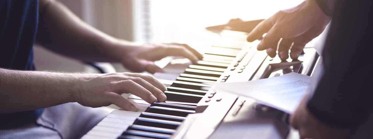 Making music on a keyboard; Explore Regent's B.M. in Church Music degree.