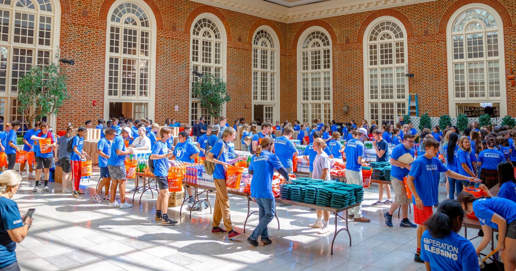 Students packing relief kits: Explore Regent's work with Operation Blessing