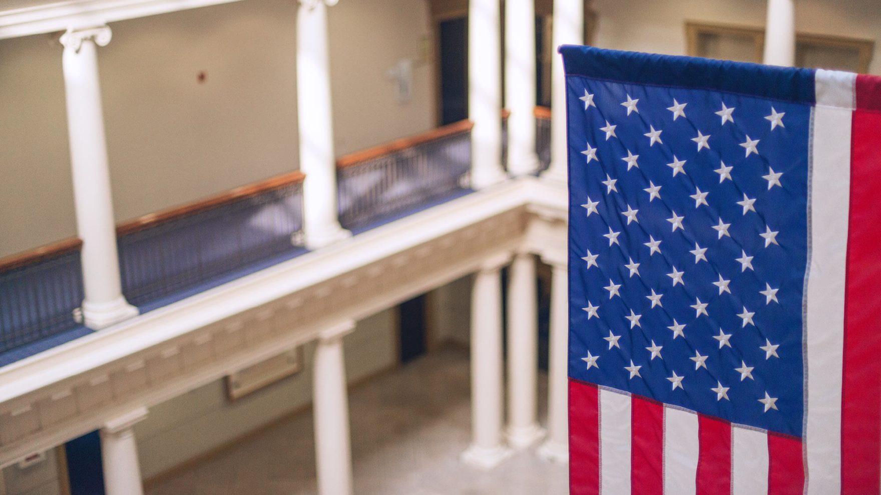 Photo of the American flag inside of Robertson Hall at Regent University in Virginia Beach: Learn more about Regent's School of Law programs.