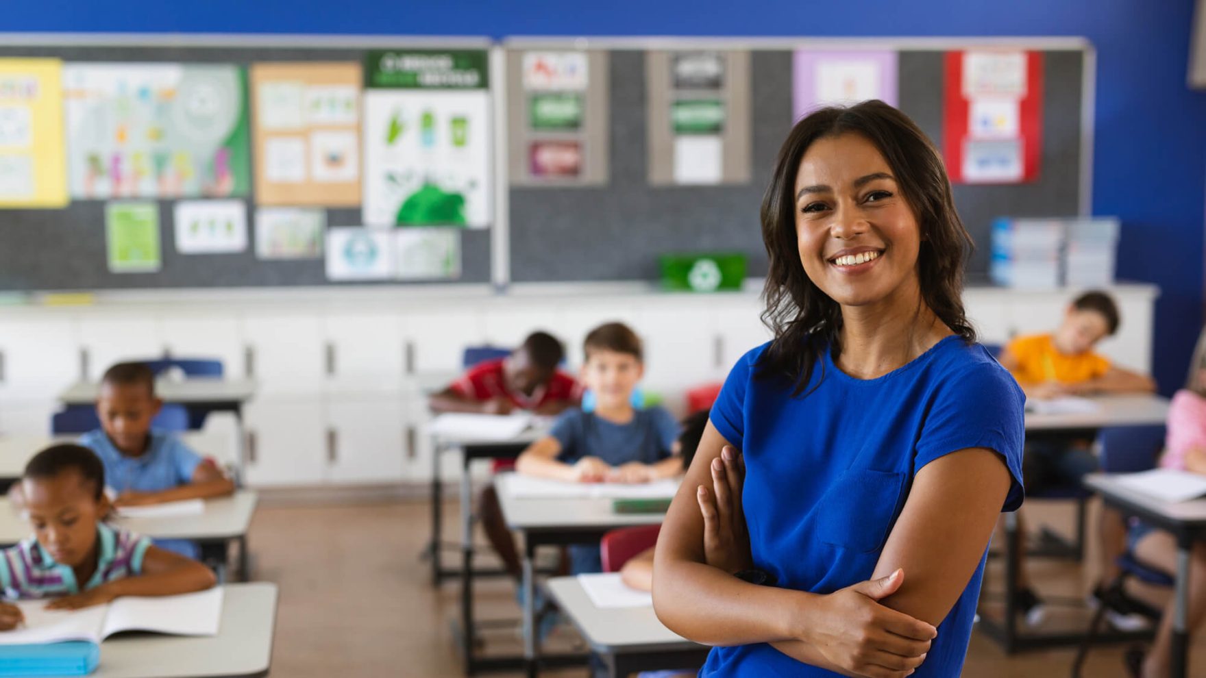 A teacher with a student: Pursue a Provisional Teaching License in Virginia, VA.