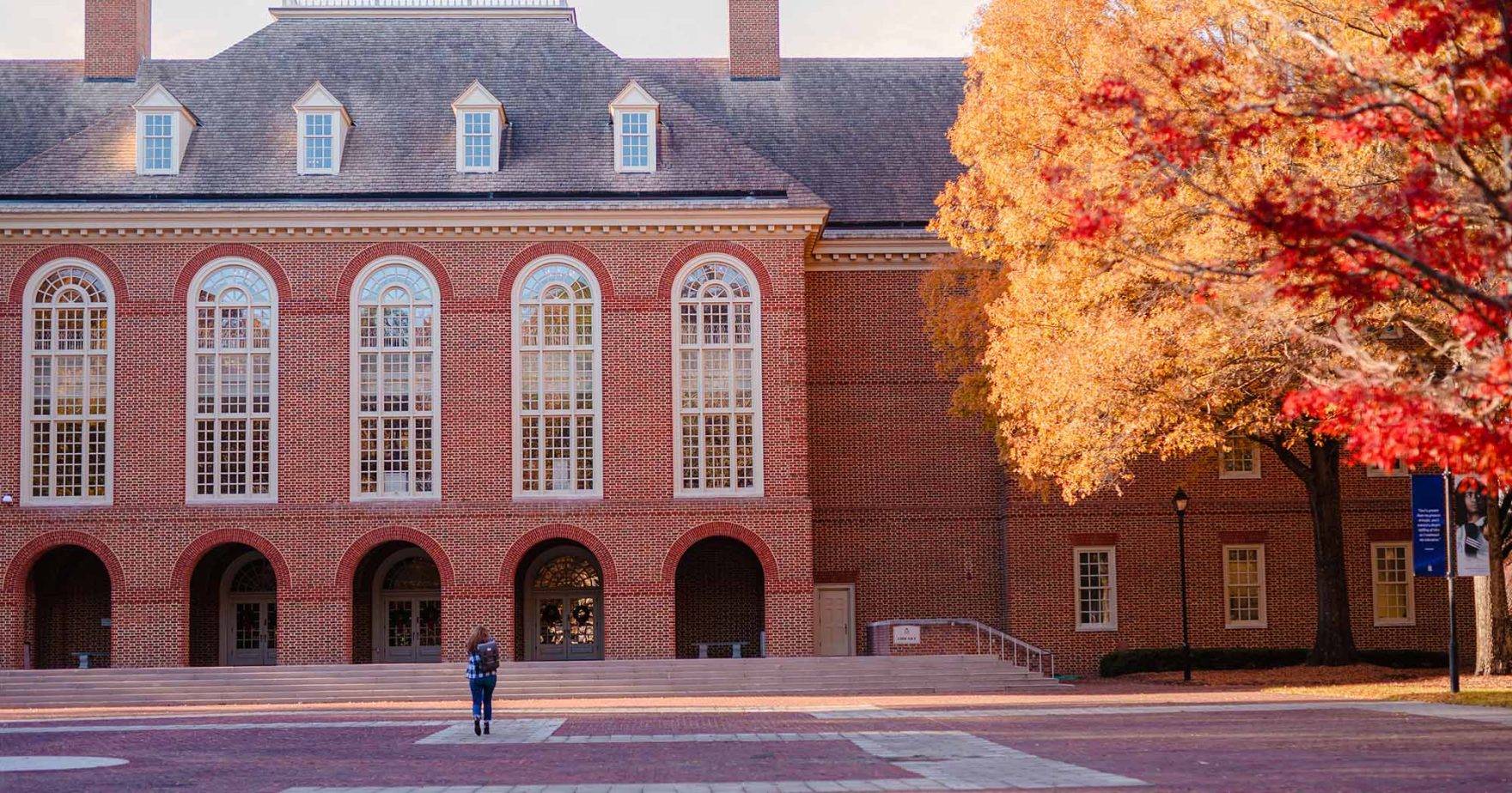 A photo of Regent University Library during the fall season: Learn more about Regent's rankings.