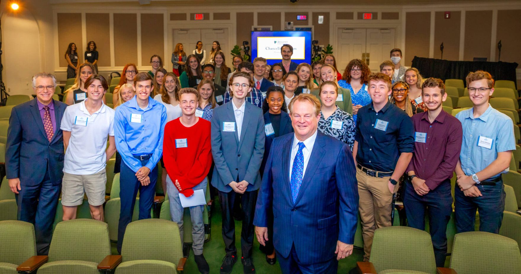 A photo of Chancellor Gordon Robertson and Students from the Honors College. Explore Regent University's on-campus programs.