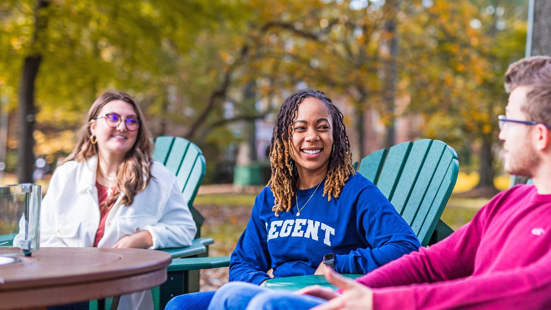 Photo of Regent students on campus: Explore Regent University's online and on-campus programs.