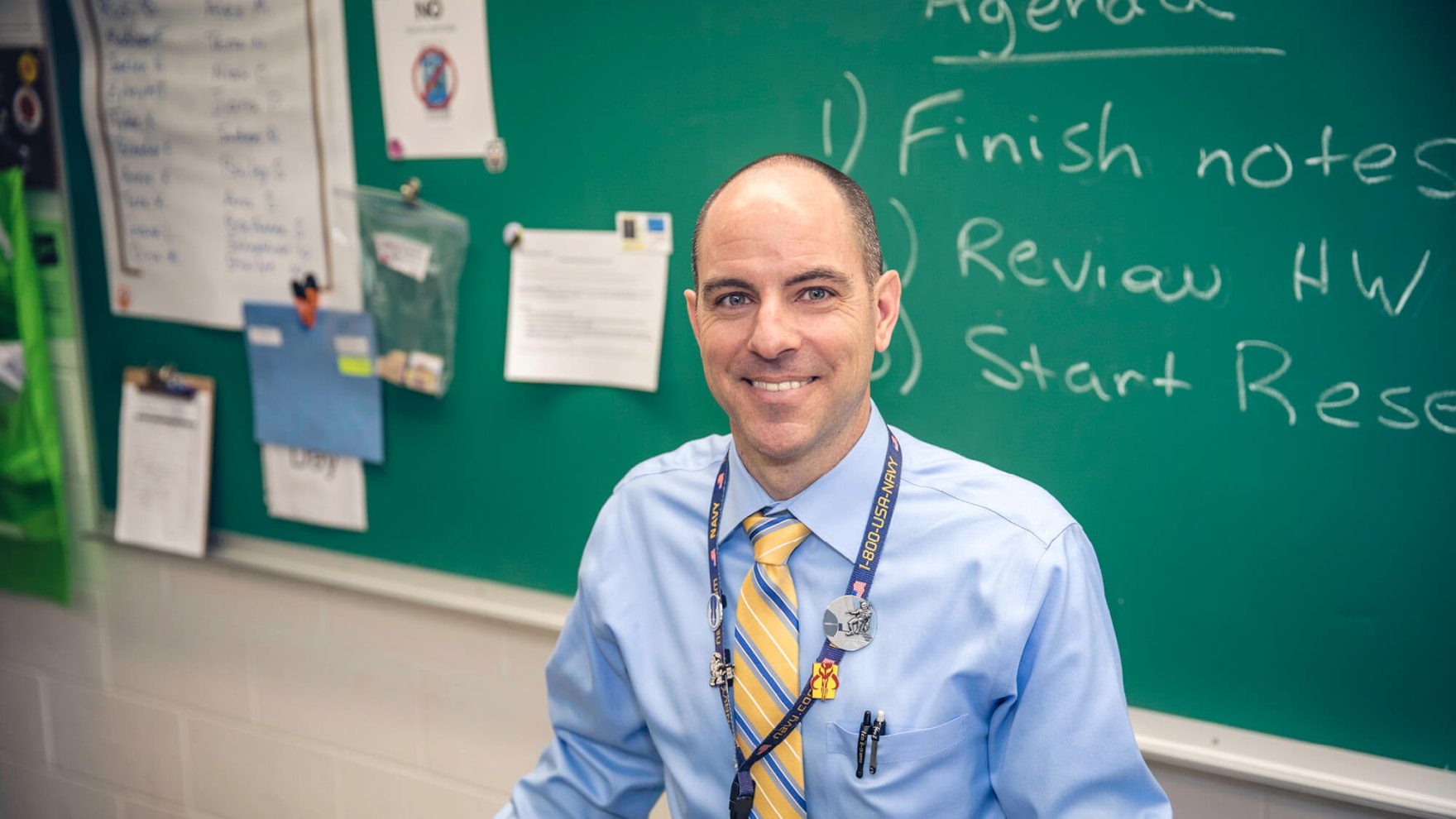 A photo of a Regent Alum, John Pienkowski in his classroom: Learn more about the Career Switcher Program at Regent University.