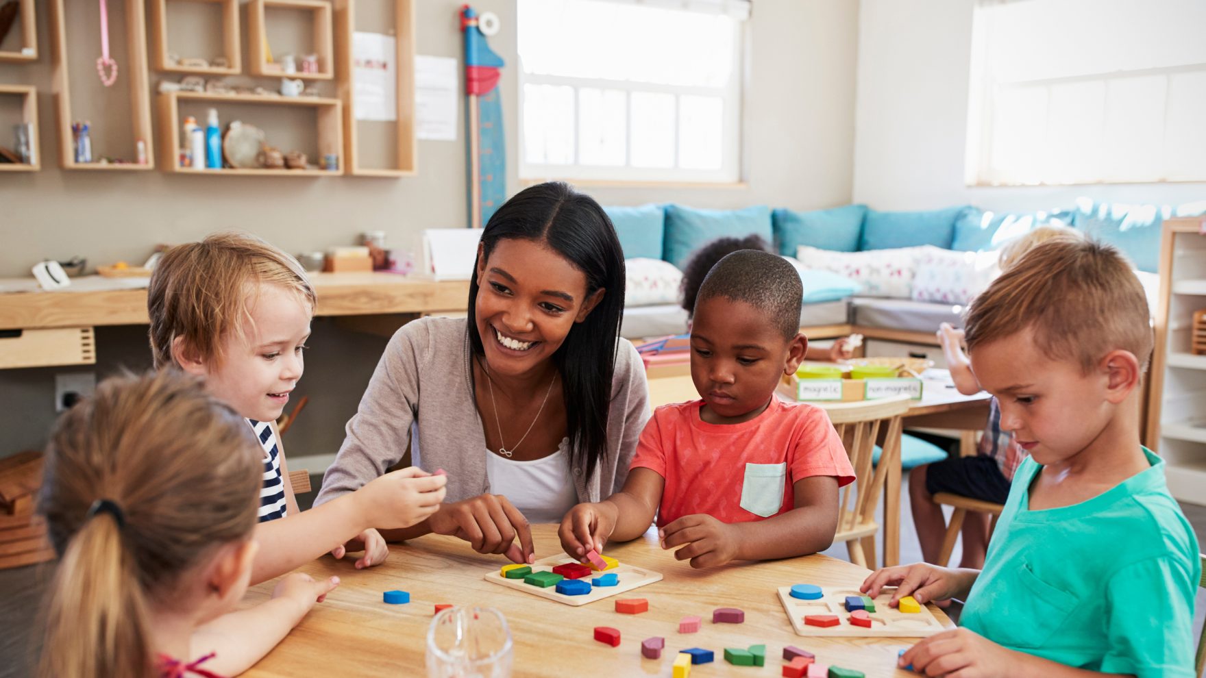 A photo of a teaching the classroom with students: Learn more about Regent's Career Switcher Program.