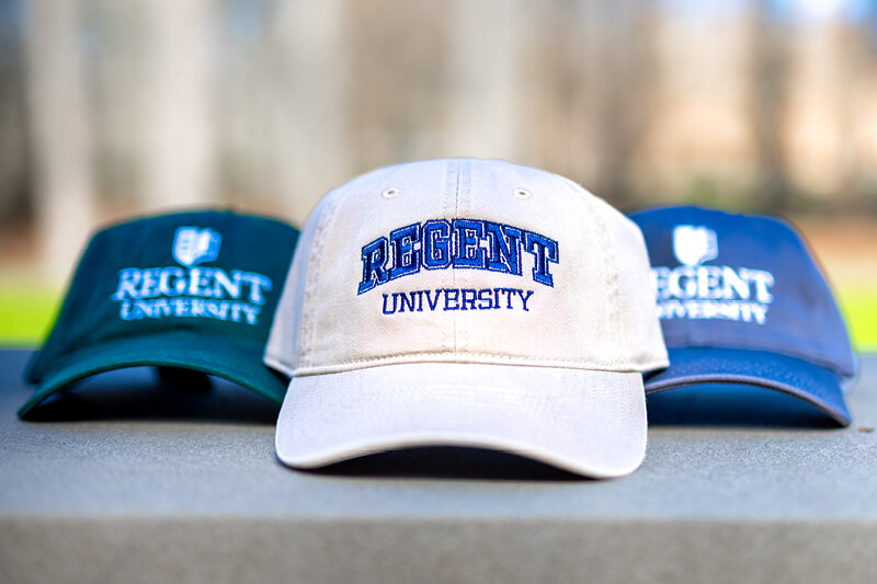 Regent hats from the Gift Shop in green, blue, and beige.