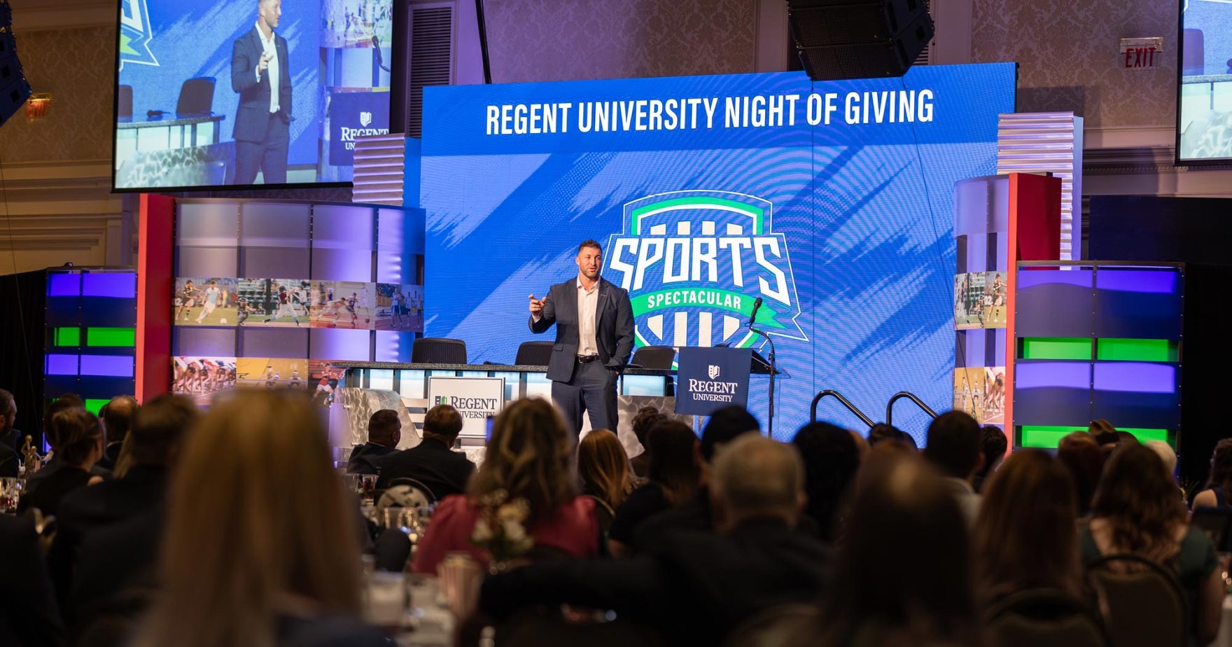 Tim Tebow Speaks to a crowd at Regent University Night of Giving