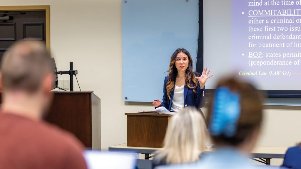 Regent University Professor teaching in a class.