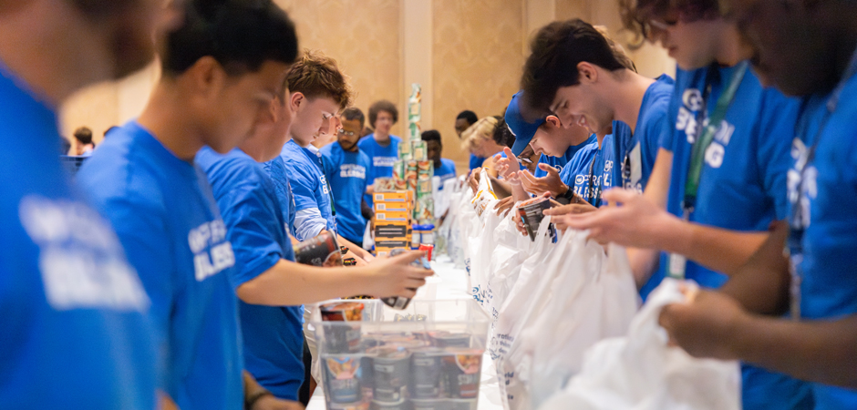 Packing meal kits: Regent University students making a difference with Operation Blessing service