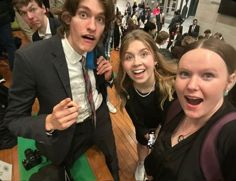 Student with exaggerated fisheye close-up at a restaurant table