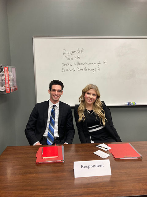 Oral argument before a three-judge panel in a courtroom