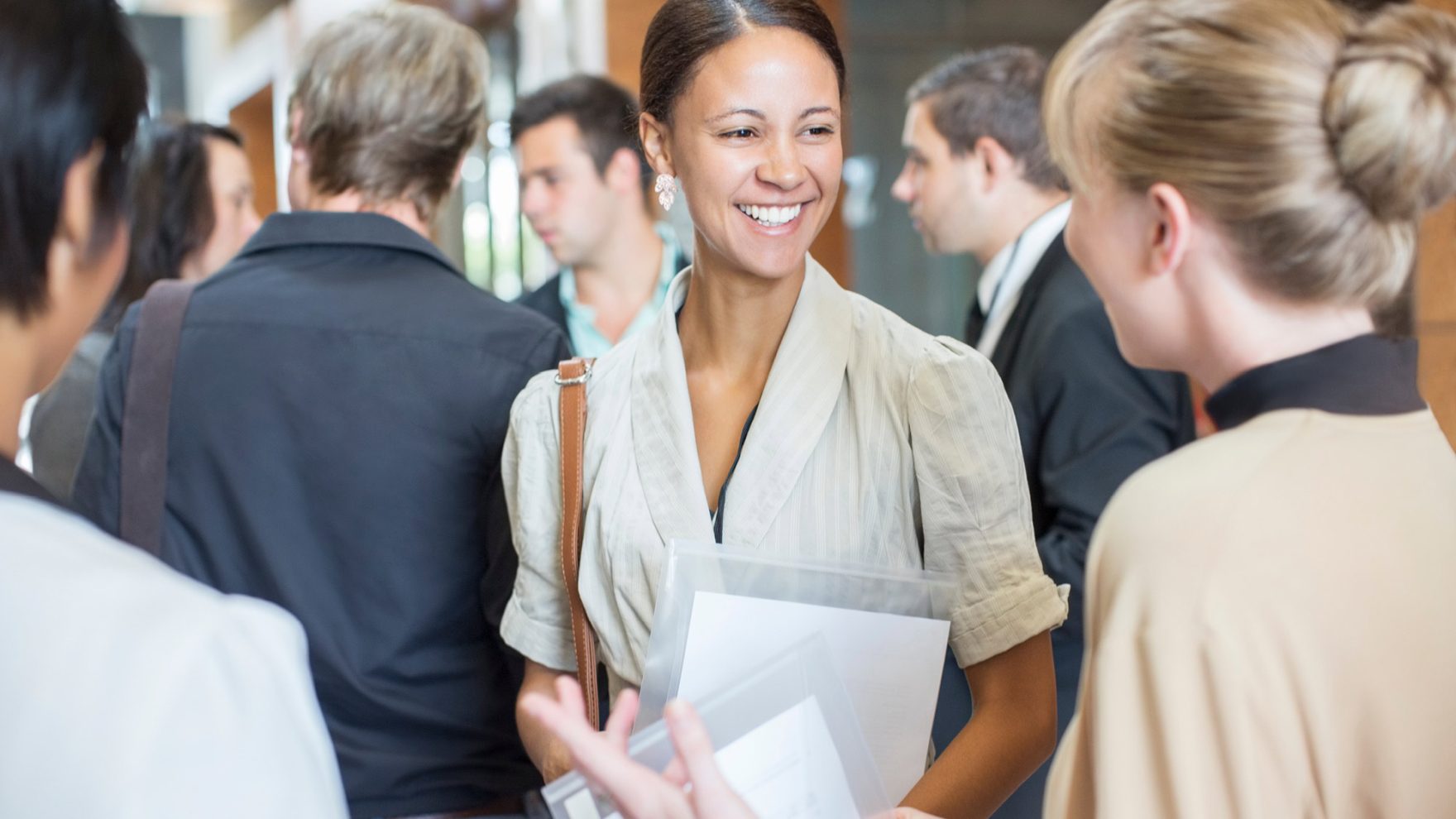 College students at Regent University career fair learning benefits of networking