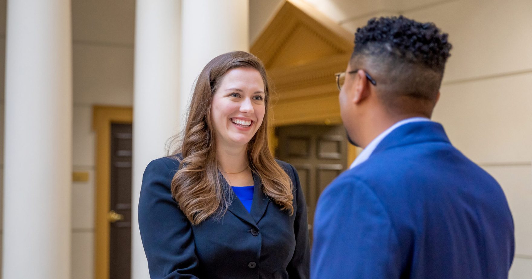 A School of Business & Leadership professor speaking with a student at Regent University in Virginia Beach, Virginia.