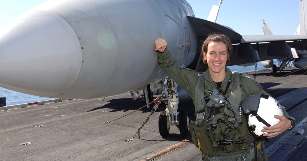 Regent Alumna, Rebecca Calder, by a fighter aircraft.
