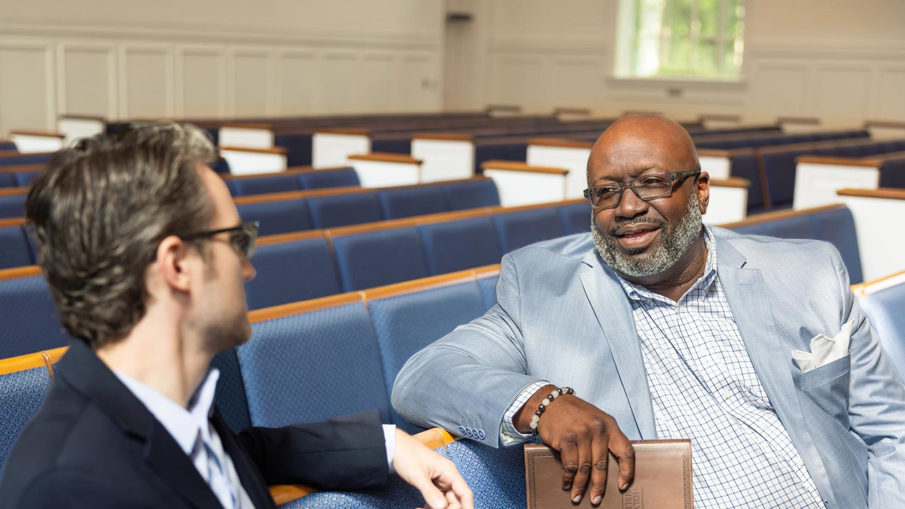 chaplains talking in a church setting.