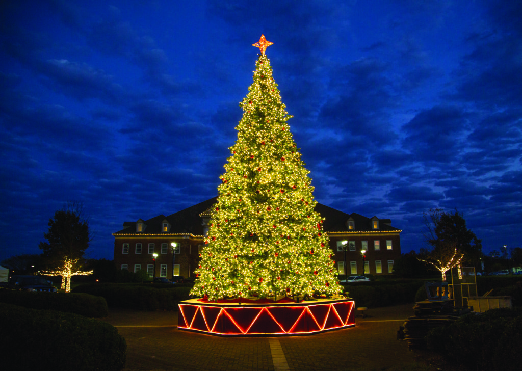 Large decorated Christmas tree with lights at CBN Christmas Village at Regent University
