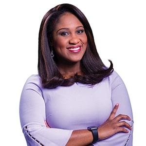 Ashley Smith, Regent University alumna and co-anchor of 13News Now “Daybreak” in Norfolk, Virginia, smiles confidently in a professional portrait.