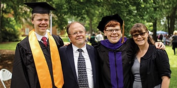 Regent University graduates Jason and Noah Montgomery celebrate commencement with their parents, Ken and Michelle Montgomery.