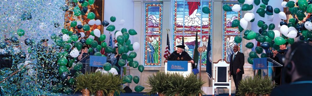 Regent University virtual commencement 2020 in Shaw Chapel with balloons, confetti and stained glass windows