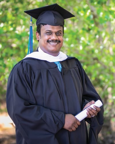 Jerry Ajex Palvannan in graduation regalia
