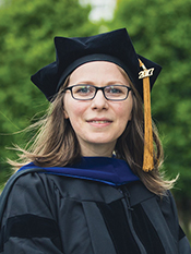Ligia Petan, Regent University School of Business and Leadership outstanding PhD graduate in doctoral regalia