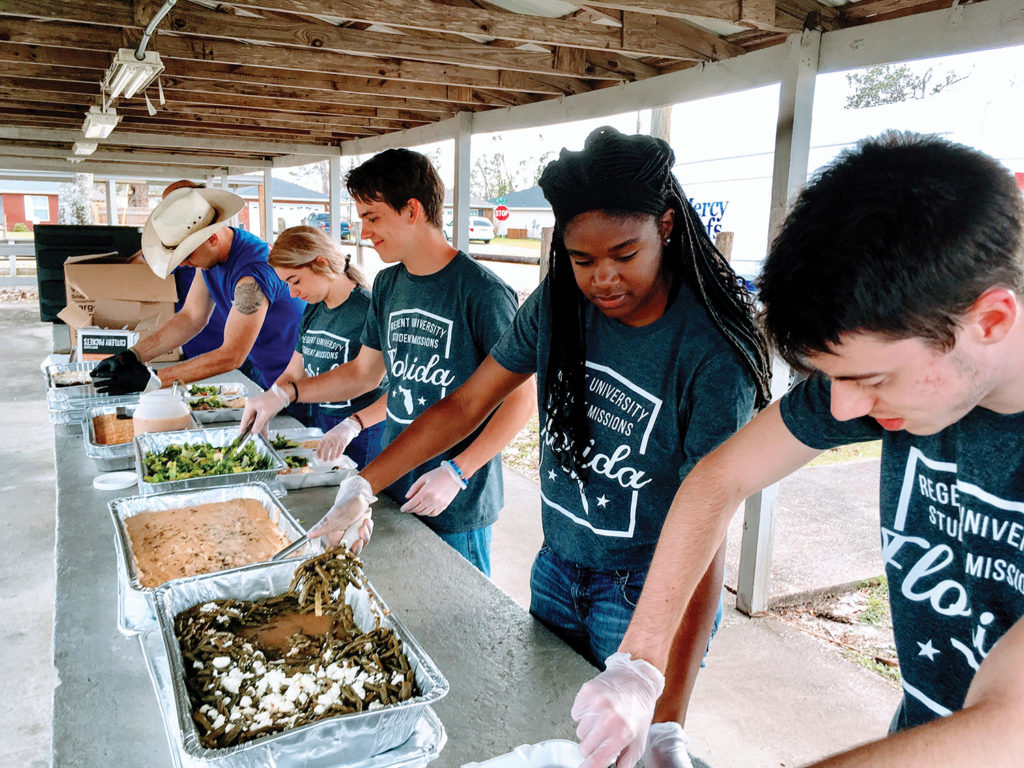 Regent University students serve hot meals to Hurricane Michael victims during a spring break mission trip in Panama City, Florida.