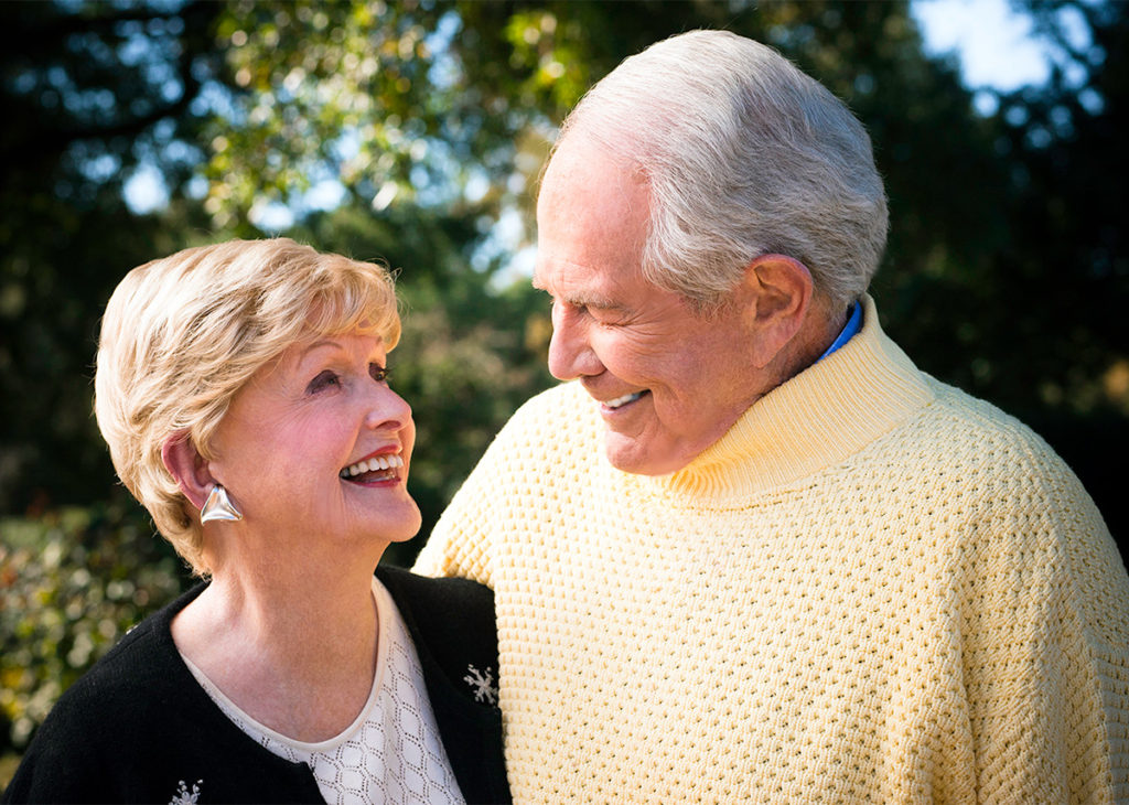 Dede and Pat Robertson smiling together outdoors
