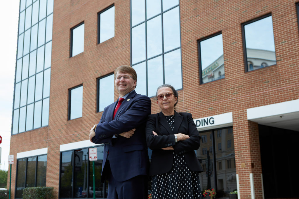 Dean Mark Martin and Associate Professor Kathleen McKee stand outside the new Grace Community Law Clinic in downtown Norfolk, Virginia.
