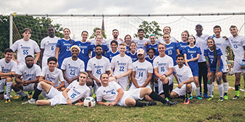 Regent men's soccer team posed on field