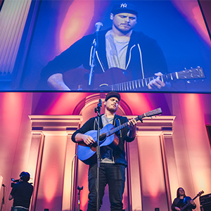 Cory Asbury performing at Regent University Night of Worship event