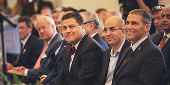 cutting edge wide photo leadership listening to presenter and smiling