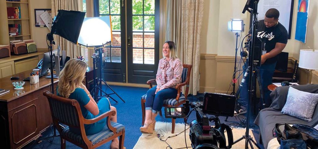 Regent University Center for Global Justice film crew records an interview with a human-trafficking survivor sharing her story of restoration.