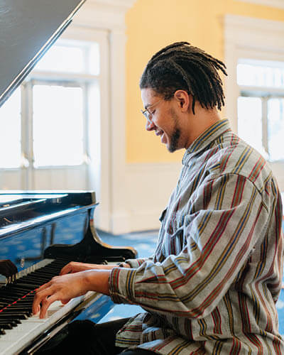 A musician playing the piano at Regent University, Virginia Beach.