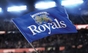 A blue Regent Royals flag waves at a stadium.