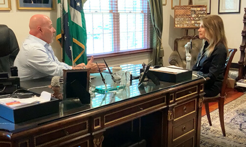 Bernie Kerik, former New York City Police Department Commissioner, and Michele Bachmann have a conversation in an office.
