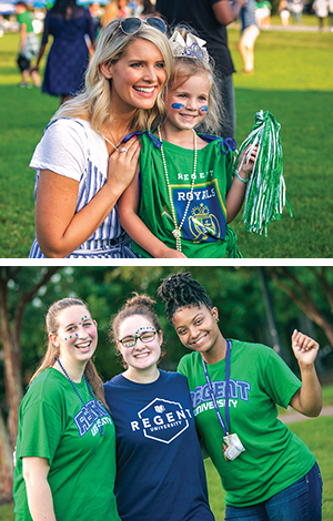 Regent University students and families show their school spirit at the Regent Royals Pep Rally, wearing green and blue and celebrating on the field.